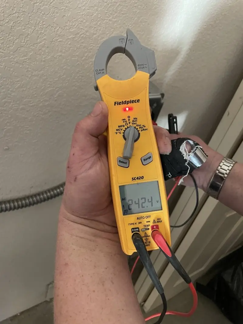 Voltage testing with clamp meter during Outlet Installation in Sherman